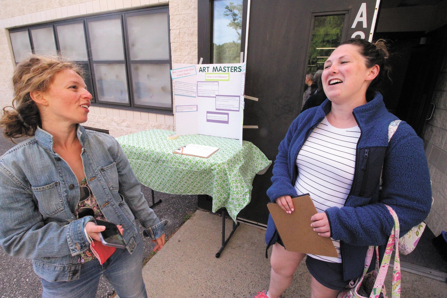 SIGNING UP: Maya Schurman and incoming Cedar Hill School  PTO President Laura Dillon were ready to sign up parents willing to share their energy  and time in supporting the school.